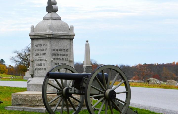 Cannon in front of statue at Gettysburg.