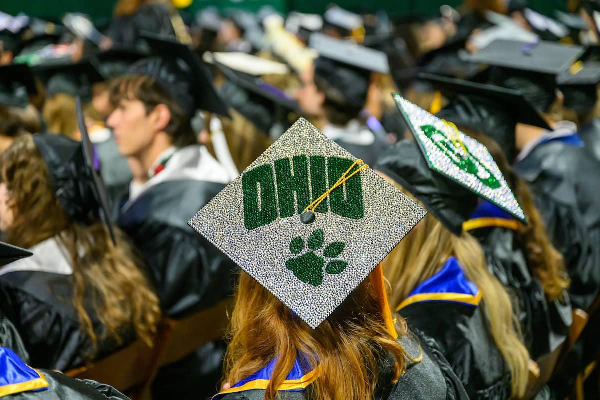 Ohio University commencement cap decorated with the OHIO logo and a pawprint