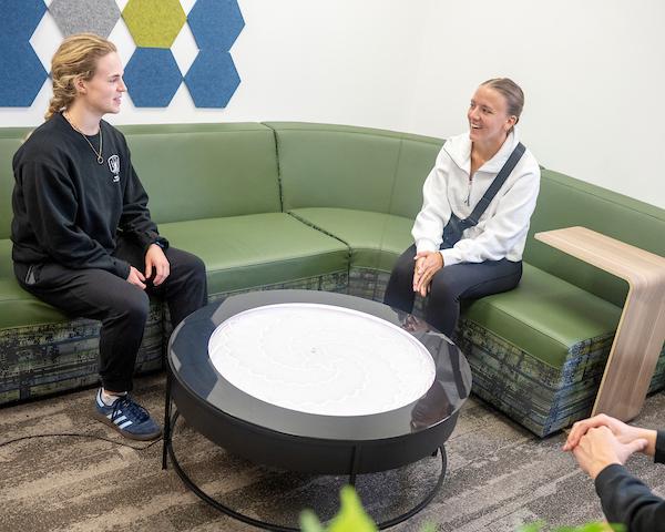 students on couch talking