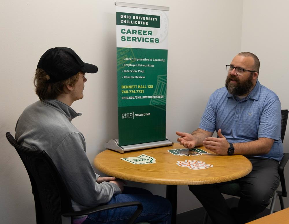 a career coach talks with a student