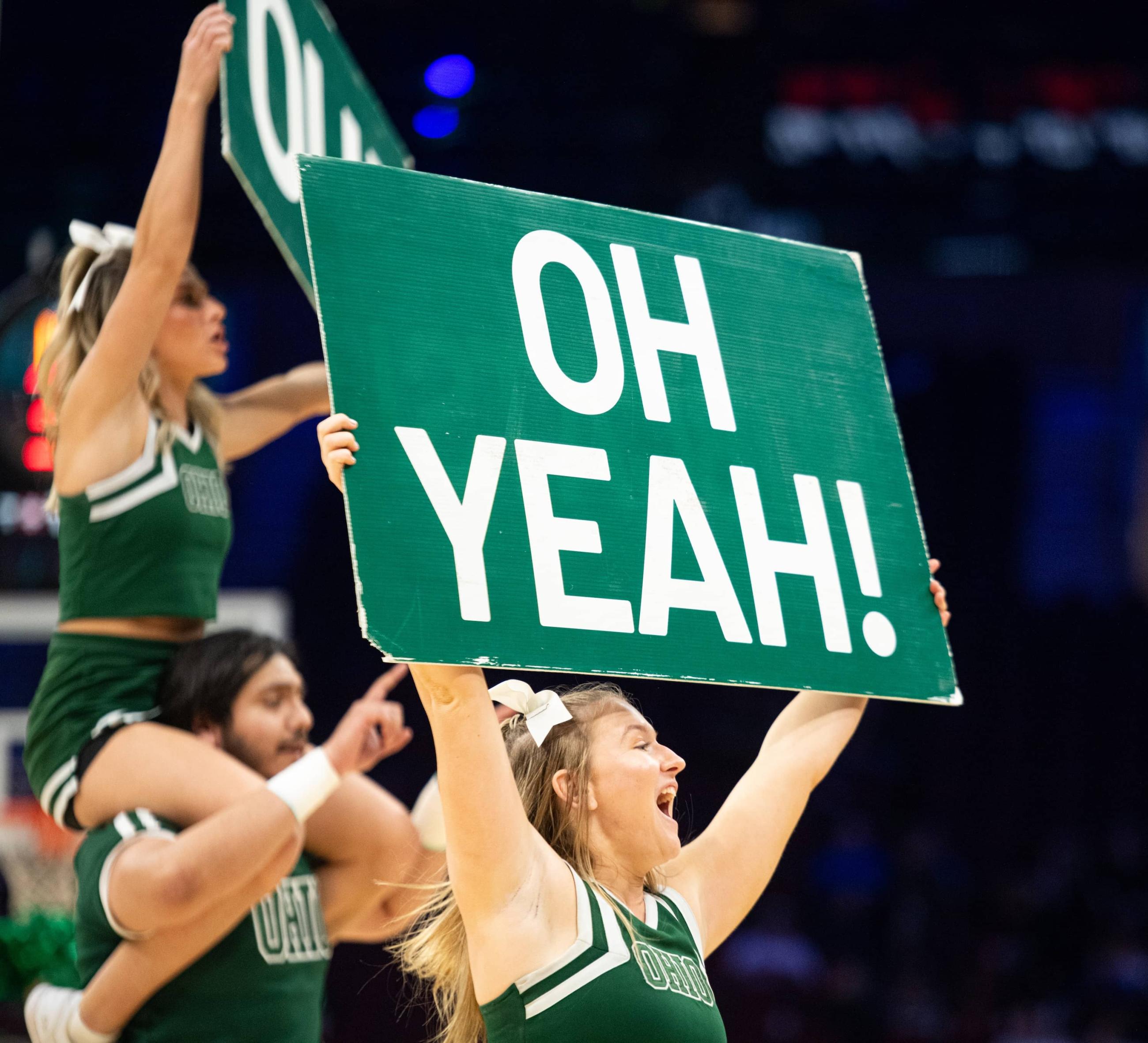 Ohio cheerleaders pump up the Bobcat crowd while the Marching 110 plays “Stand Up and Cheer” during the second half of the quarterfinal game