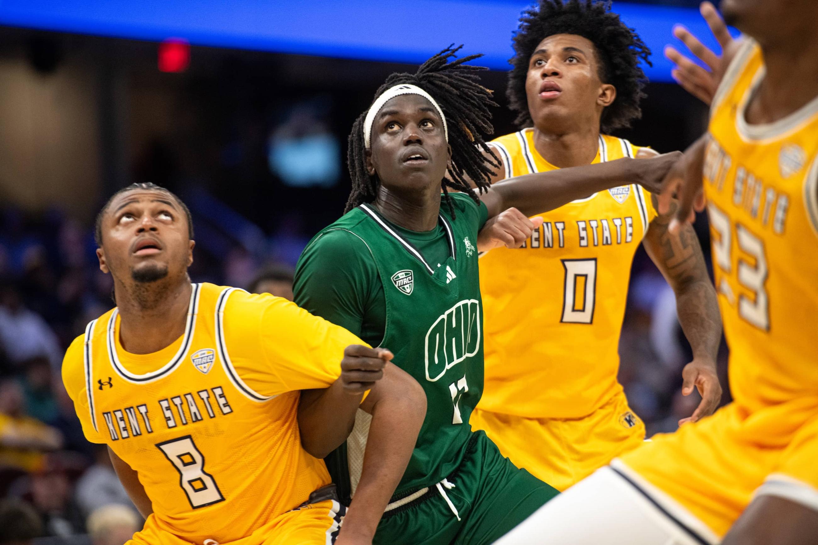 Kiir Kuany battles Kent State defenders during an Ohio free throw attempt