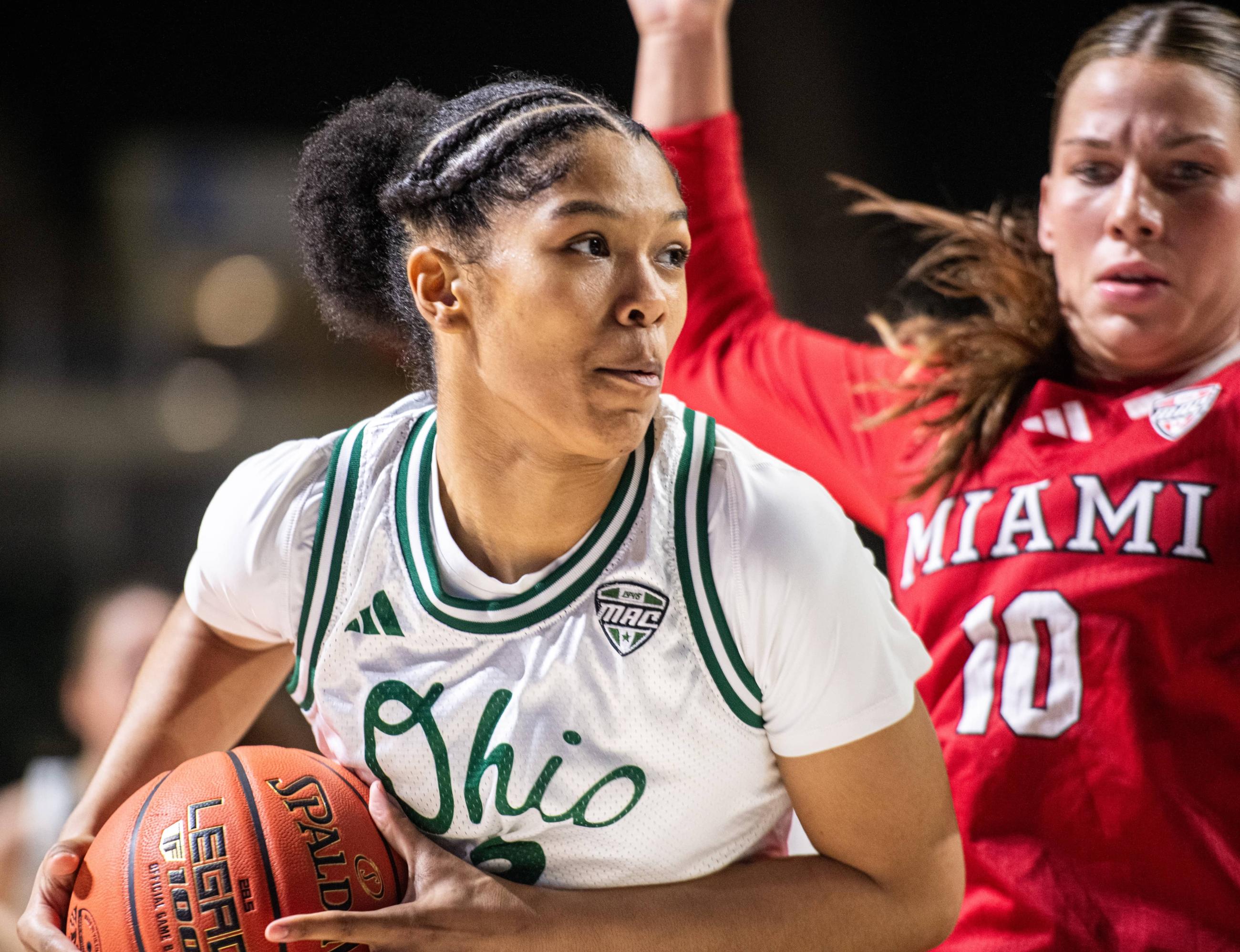Monica Williams drives the ball to the hoop against a Miami defender