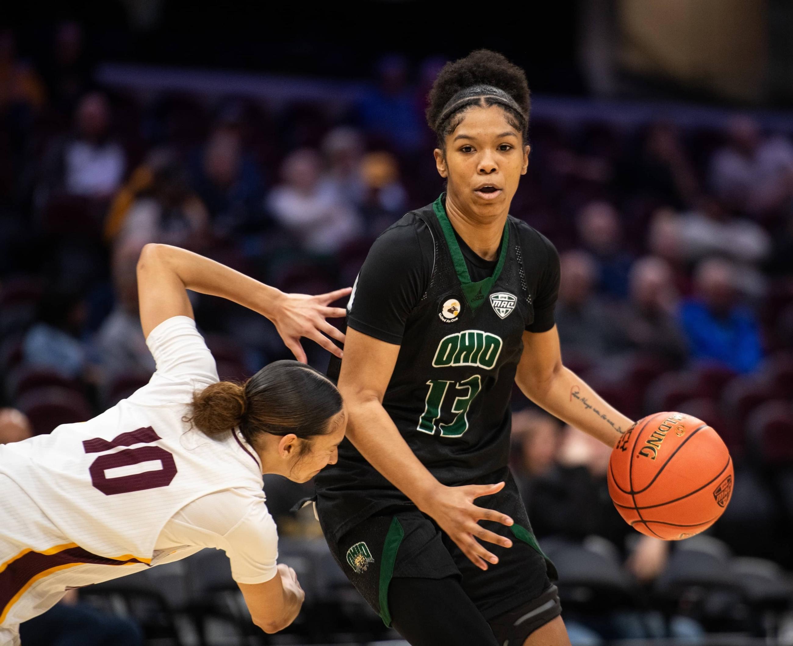 Ohio redshirt sophomore guard Monica Williams crosses over a CMU defender