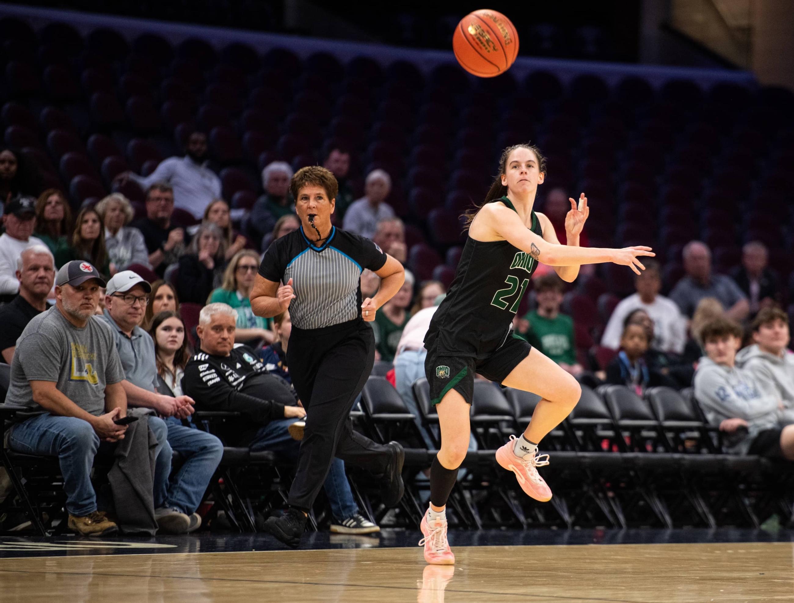 Bailey Tabeling passes the ball up the floor to a teammate.