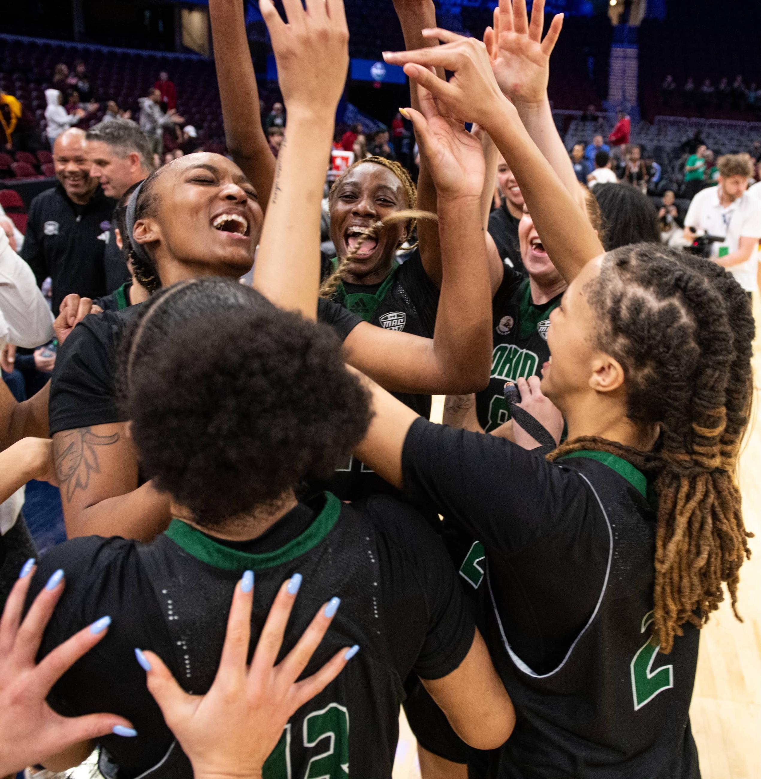 Ohio women’s basketball players celebrate on the floor after their thrilling 89-88 win over CMU in the MAC Tournament quarterfinals.