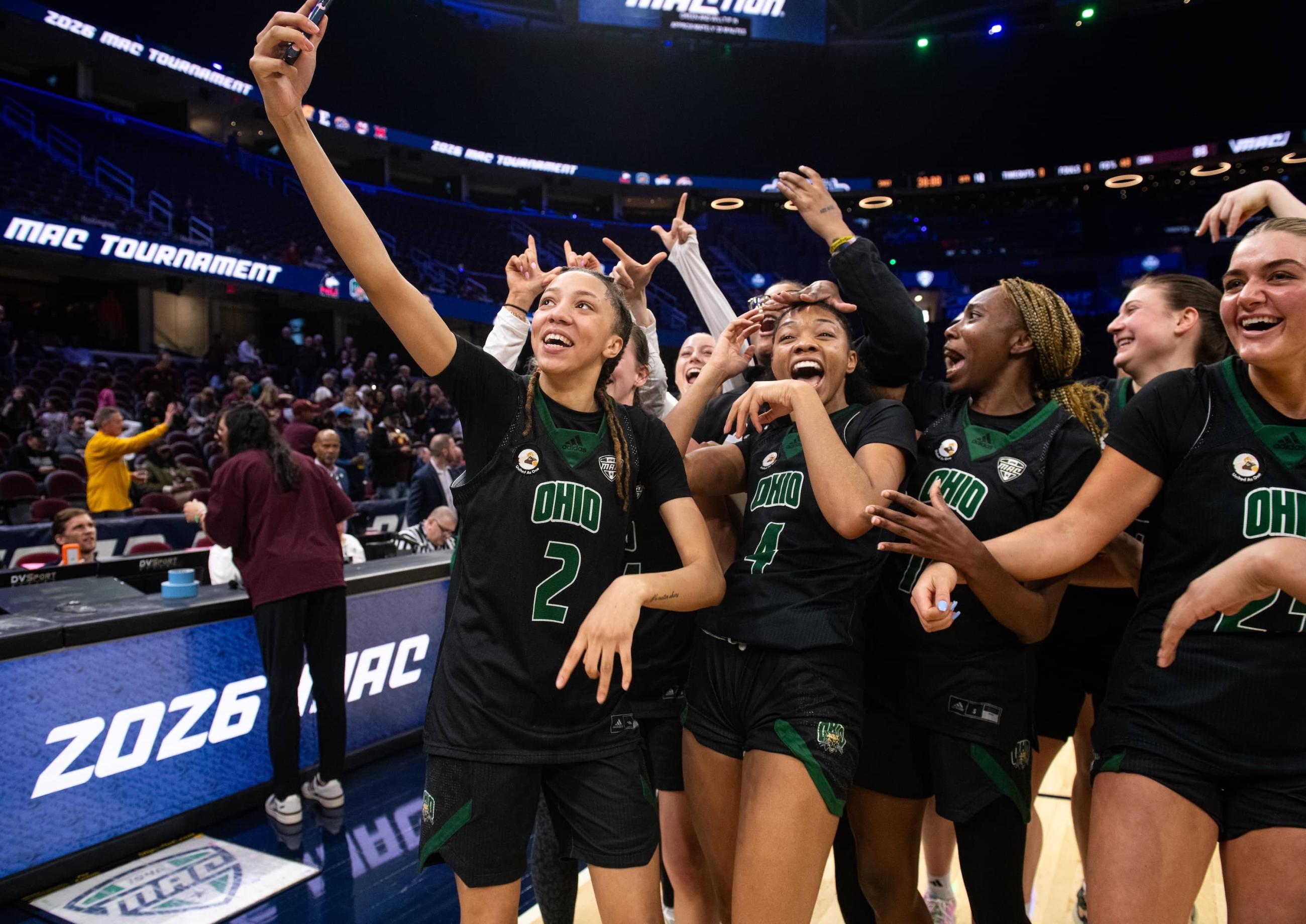 Ohio women’s basketball players take a celebratory selfie video for MAC social media after their win.