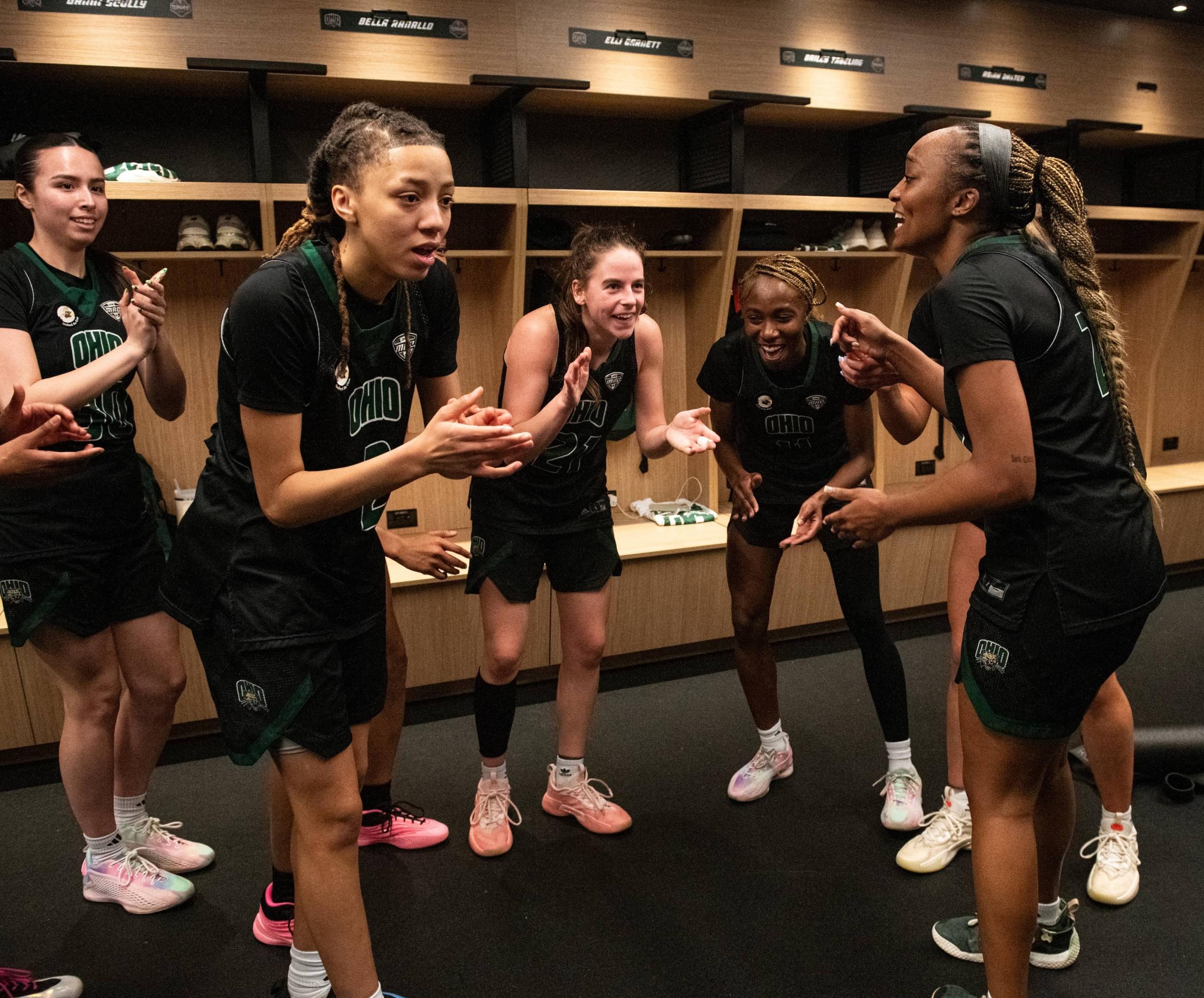 Ohio women’s basketball players celebrate in the locker room after their first MAC Tournament win since 2021.