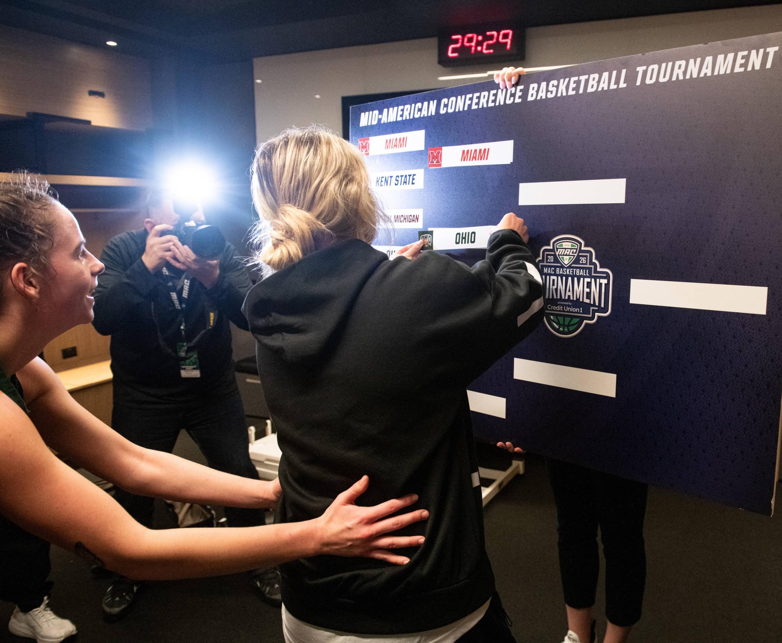 Injured Ohio point guard Bella Ranallo slaps the “Ohio” sticker onto the semifinals slot of the bracket.