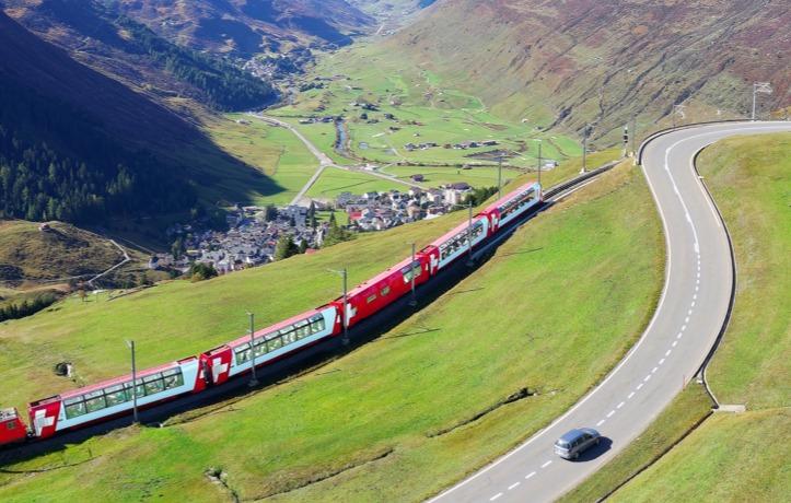 Train traveling through the Swiss Alps.