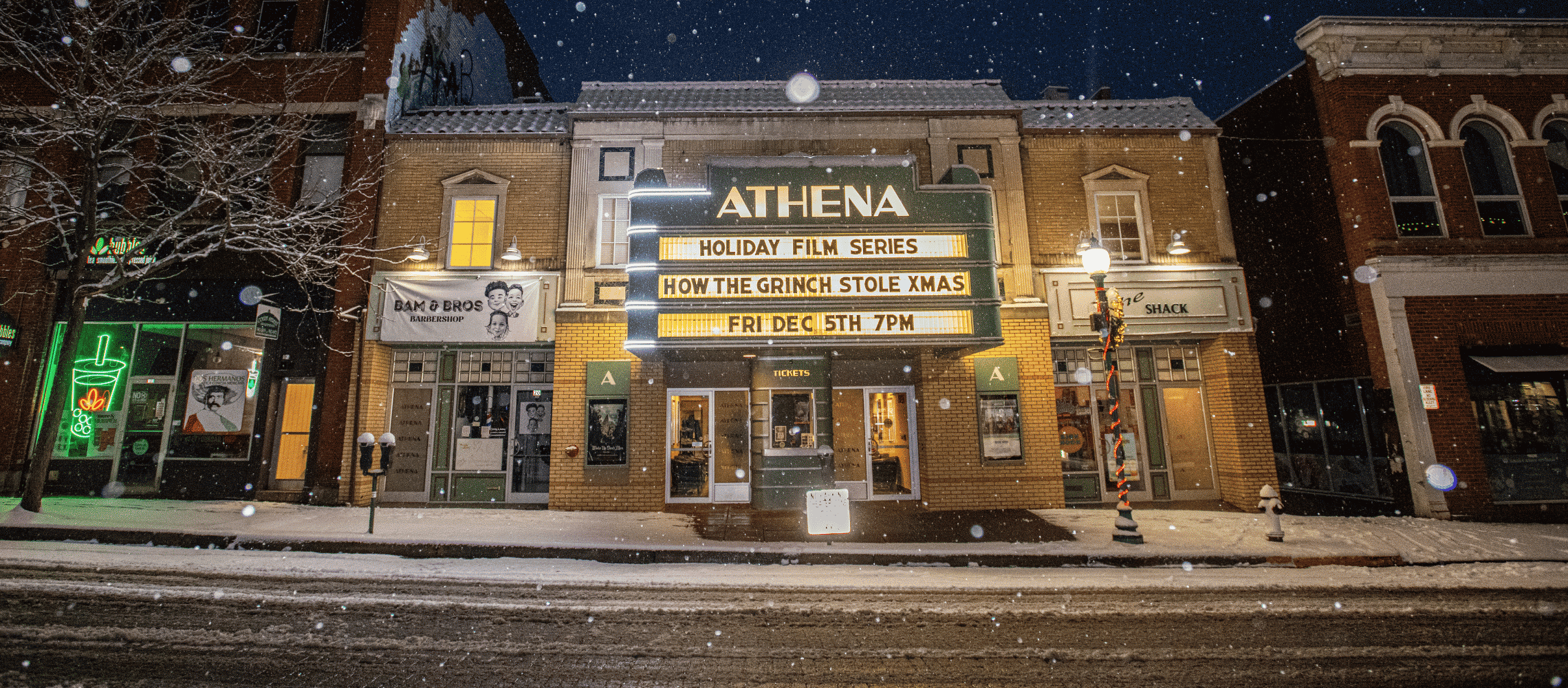 Athena Marquee displaying holiday film series in snow