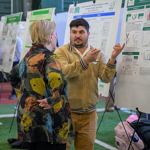 A student presents his research project during the Ohio University Student Research and Creative Activity Expo
