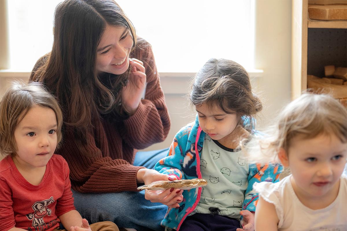 A student works with toddlers at OHIO's Child Development Center.