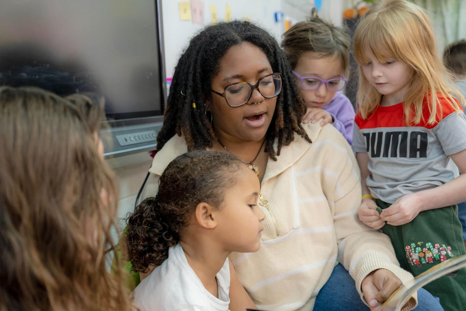 A Patton College of Education student reads to students at a local elementary school