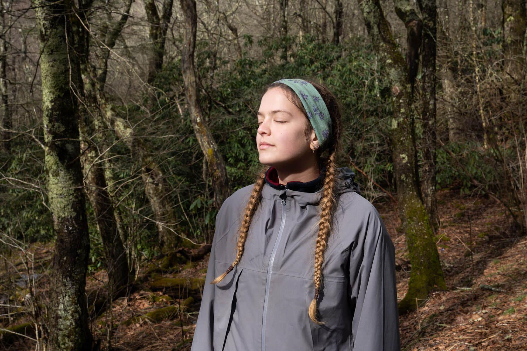 Regan Magee takes a moment to herself in the sunlight during her fifth day backpacking a section of the Appalachian Trail in the Nantahala National Forest