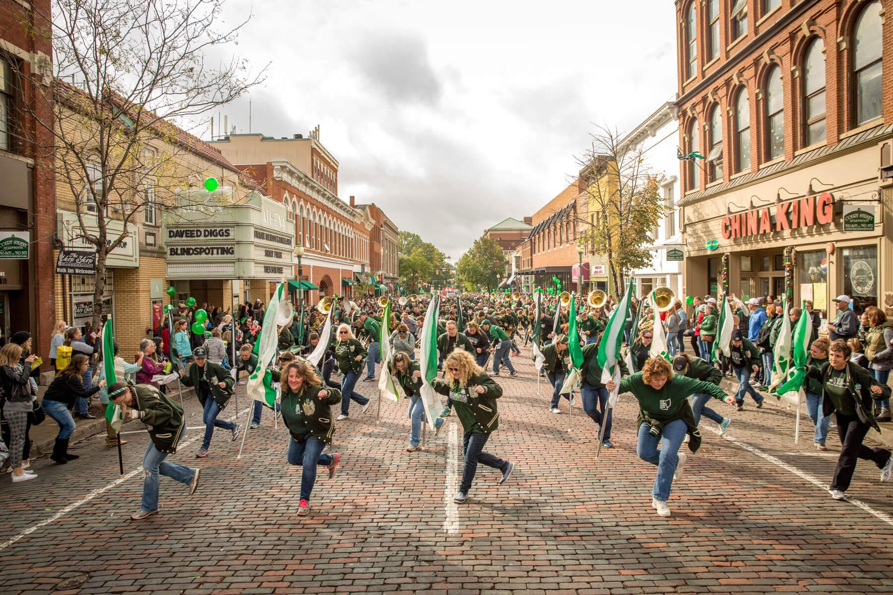 Marching 110 alumni performing in the Homecoming parade