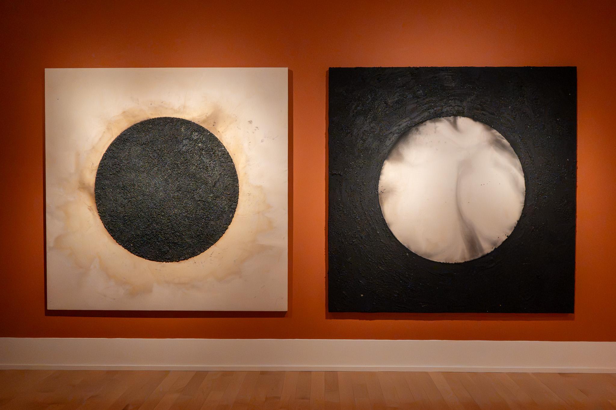 detail of two paintings in gallery installation