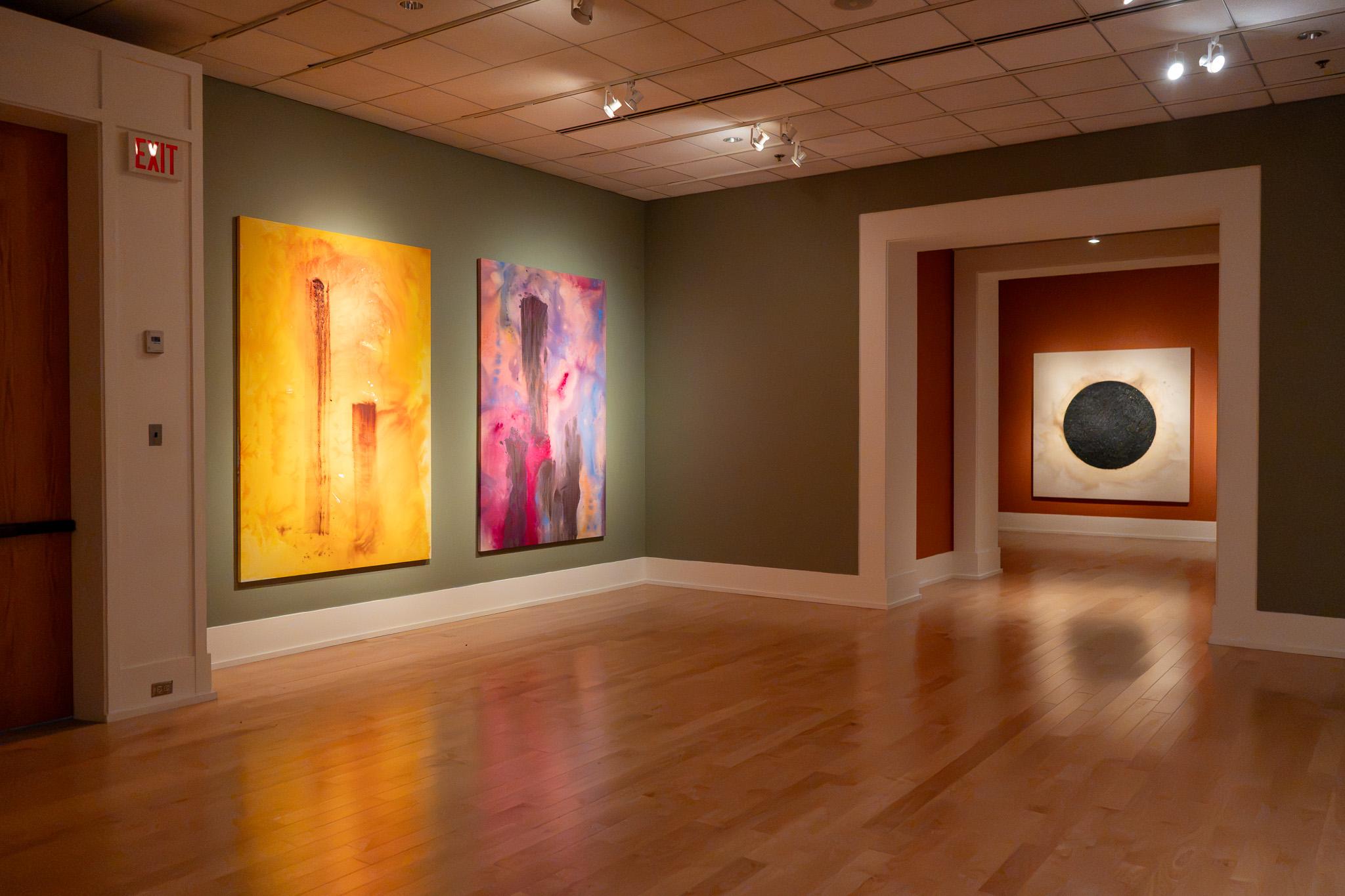 Gallery view of two paintings