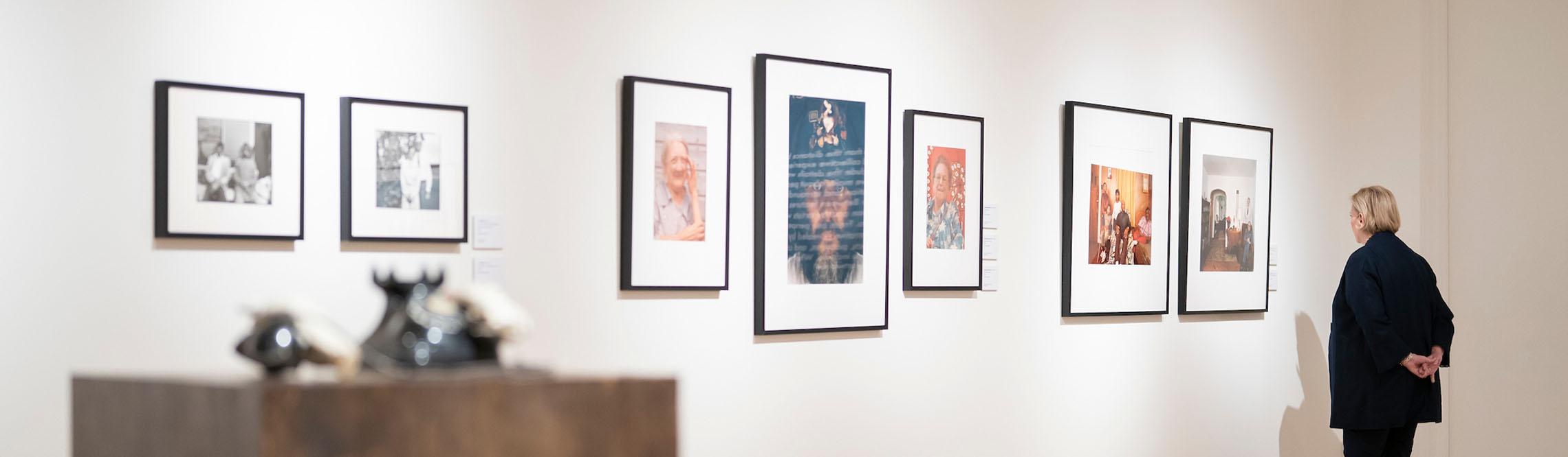 woman looks at art on the wall of kennedy museum