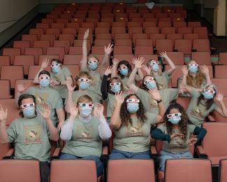 Students sitting in theater seats