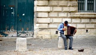 Person playing an accordion in France