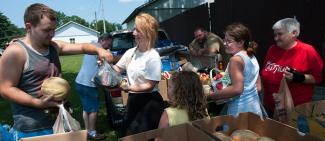 Social services volunteers work at a food bank