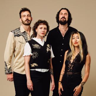 Portrait of the four members of The Crane Wives band