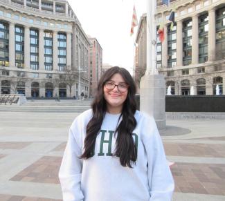 Katie Raines standing in front of memorial in DC