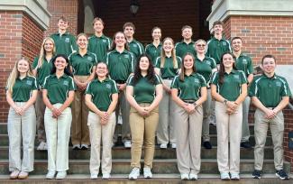 Twenty engineering ambassador students stand on the front steps of the Academic and Research Center at Ohio University