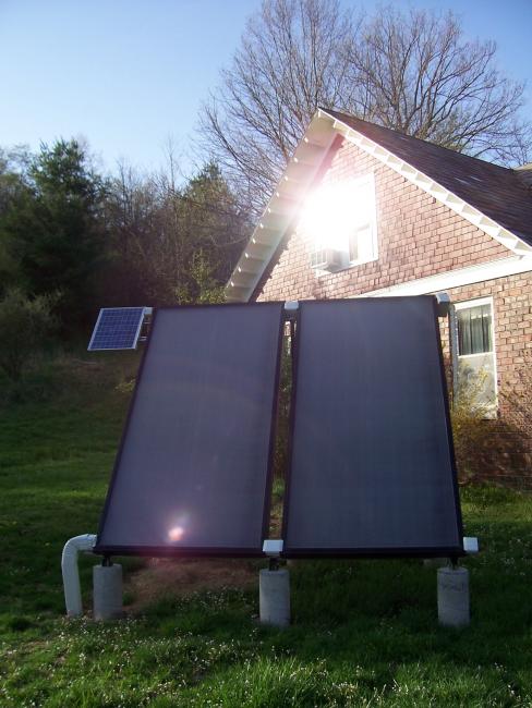 Side of the house with two solar panels. 