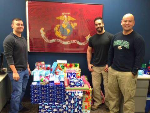 Student Veterans of America members with wrapped Christmas presents
