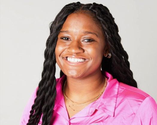 Picture of Tamya, young african american woman with dark hair and a pink shirt