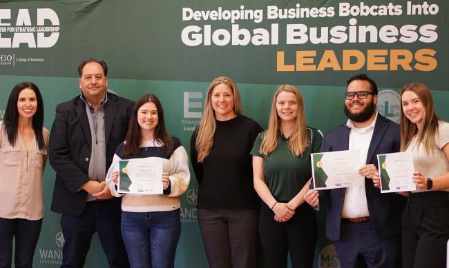 Students from the MGT 3000 class pose for a photo.