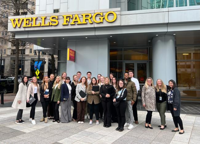 Society For Human Resource Management group standing in front of Wells Fargo