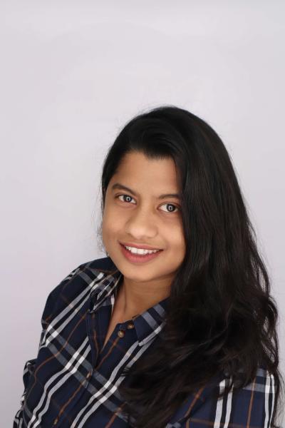 A professional portrait of Tuba Ahmad