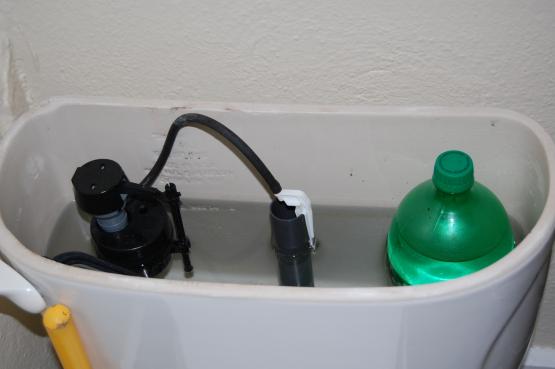 Water reduction device for toilet