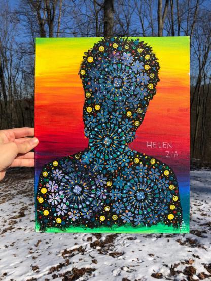 An acrylic, vertical portrait of a silhouette of Helen Zia’s head and shoulders, painted in black over a rainbow (pride) background. Overtop the black silhouette figure are mandala patterns drawn in blues, whites, and pinks, accented by a variety of smaller detailed dots in yellow, red, white, blue, green, and purple. These occupy nearly all of the silhouette, leaving few black, unpainted spots. 