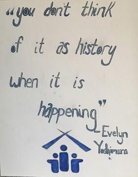 On a large white canvas, Evelyn Yoshimura’s words are written in blue paint, stating ”you don’t think of it as history when it is happening.” Yoshimura’s name is attributed beneath the quote, and centered on the bottom is the blue symbol for the Little Tokyo Service Center she helped implement. 