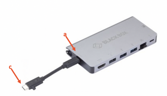 Silver "blackbox" pointing to USB-C dongle