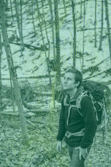 A student wearing a backpack on a hike with topography graphics overlayed