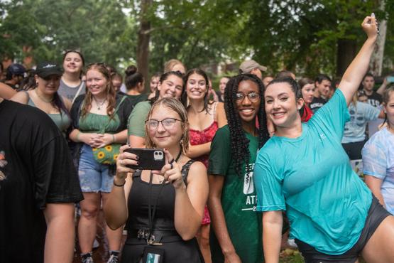 A group of students smiles at the camera in Athens at Ohio University