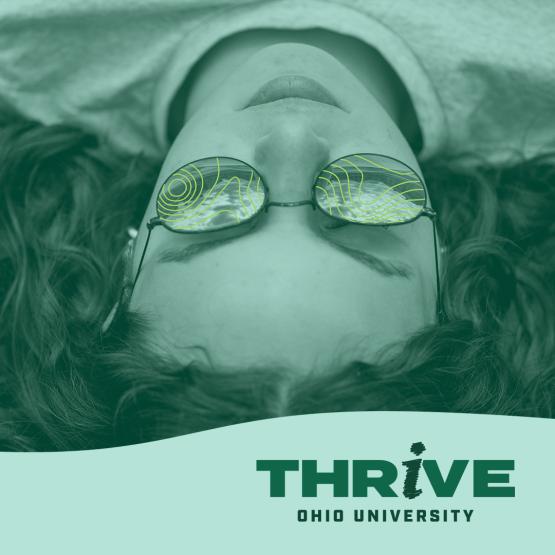 Student watches clouds on a graphic for the THRIVE well-being campaign