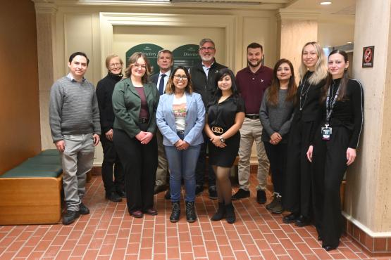 A group of people standing in a hallway