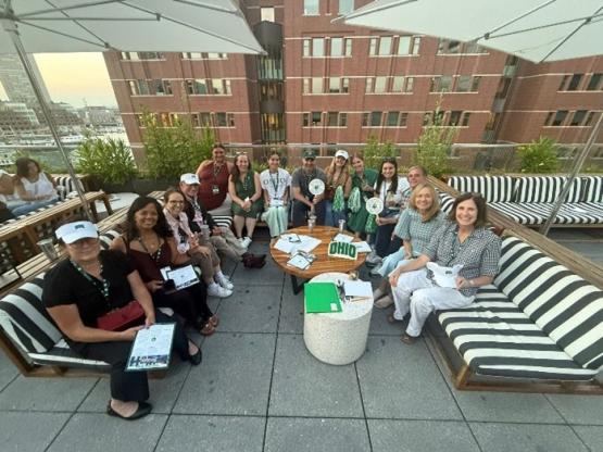 Group photo of Bobcats sitting outside on patio furniture.