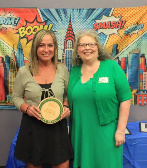 Gloria Matheny and Heather Krugman. Gloria is holding her award.
