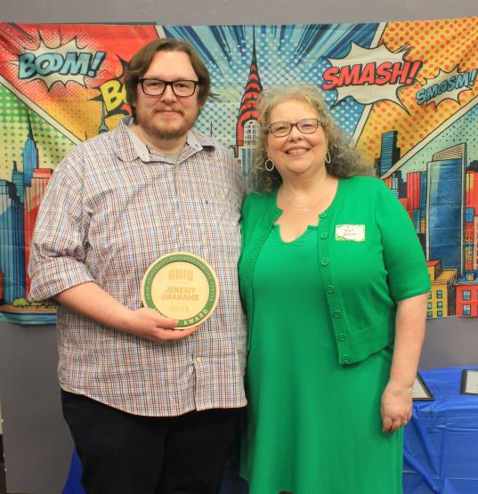 Jeremy Grahame and Heather Krugman. Jeremy is holding his award.