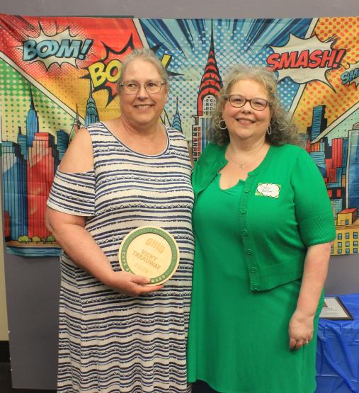 Vicky Treadway and Heather Krugman. Vicky is holding her award.