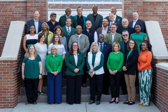 Group photo of the OUAA Board standing on steps.