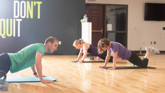Group fitness class doing planks