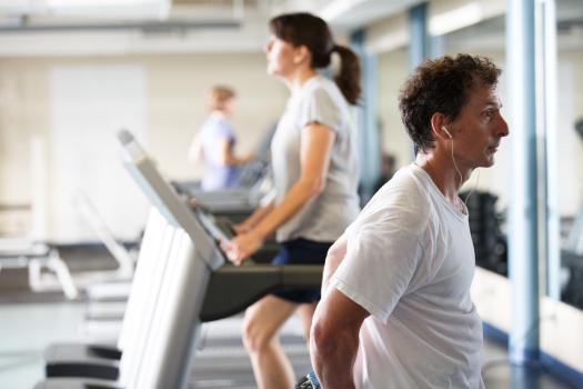 Man and woman exercising in WellWorks fitness center